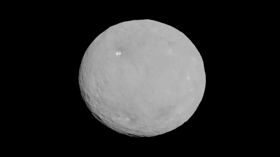 Image of Ceres showing a round, gray dwarf planet with bright spots and craters.