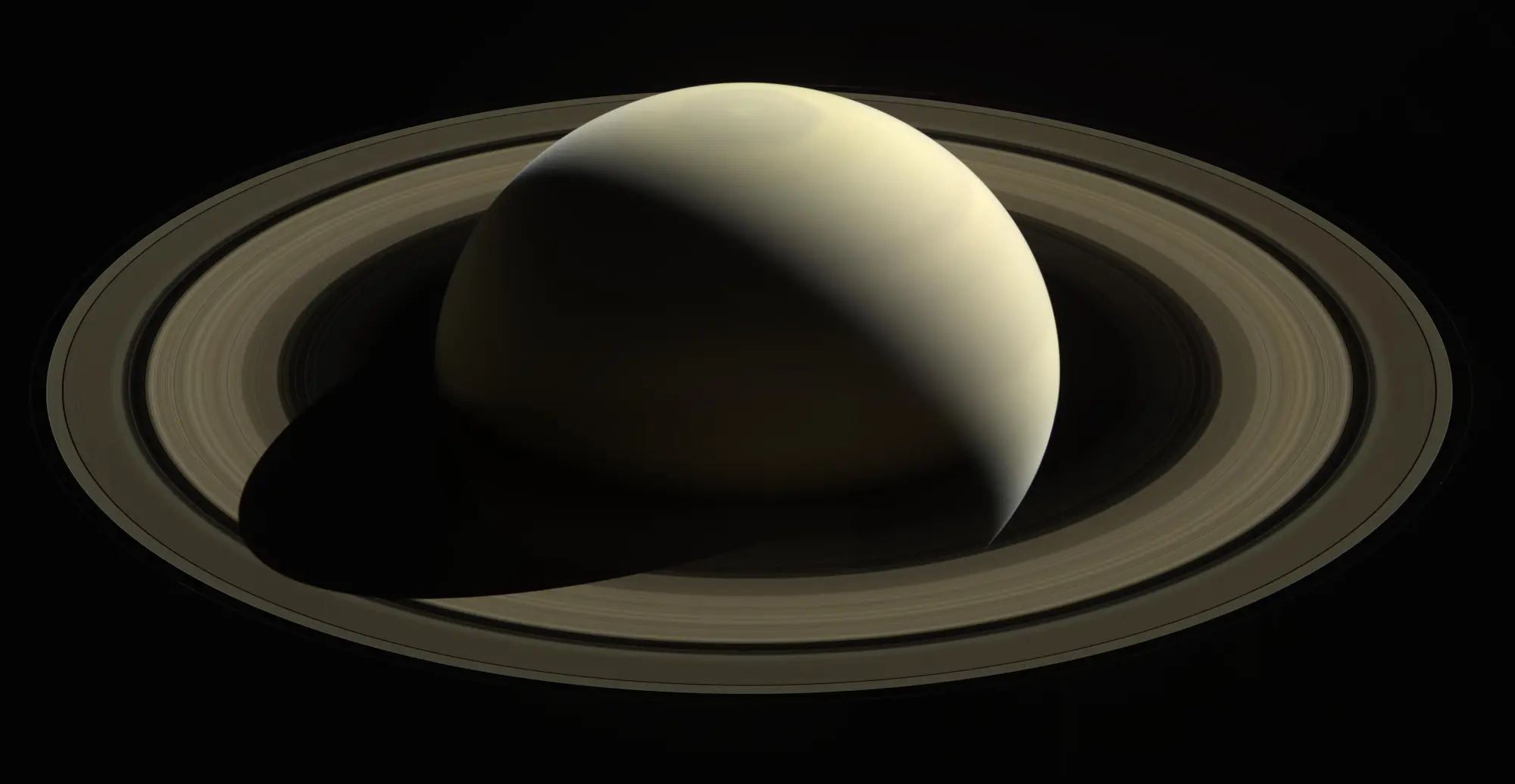 Image of Saturn showing its rings and cloud-banded atmosphere.